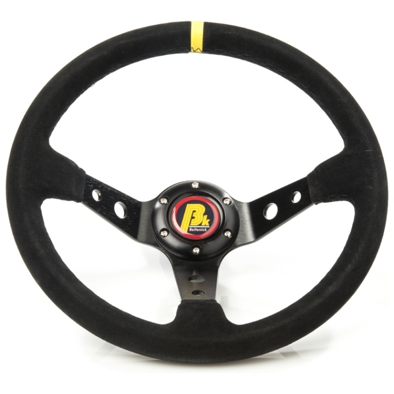 Sporty steering wheel made of luxurious suede with three spokes and a distinctive yellow marker.