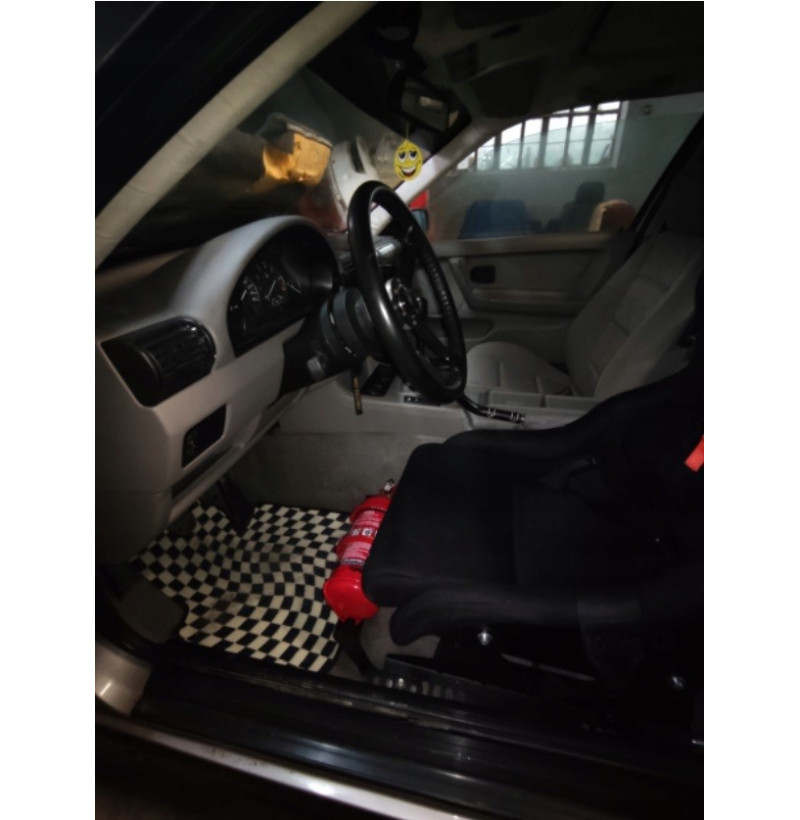 Adjustable fire extinguisher holder BMW for seat mounting 4 Side view of the extinguisher bracket with the mounting points for the original seat holes